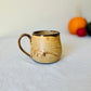 Matte Ginger Mug on Black Stoneware