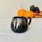 13.5 floz  Chrome & Black Stoneware Pumpkin Mug